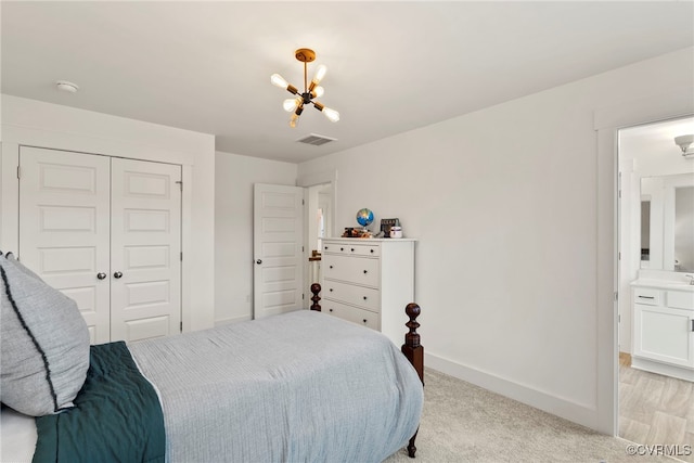18207 Maple Summit Ct, Moseley, VA 23120 - bedroom featuring a chandelier, a closet, and light colored carpet