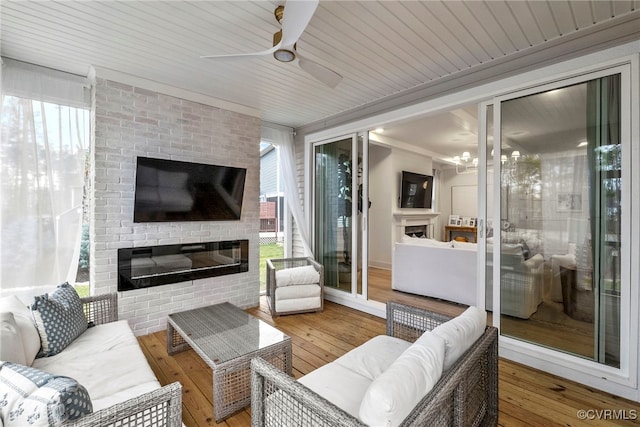 18207 Maple Summit Ct, Moseley, VA 23120 - living room with a glass covered fireplace, ceiling fan, healthy amount of natural light, and hardwood / wood-style flooring