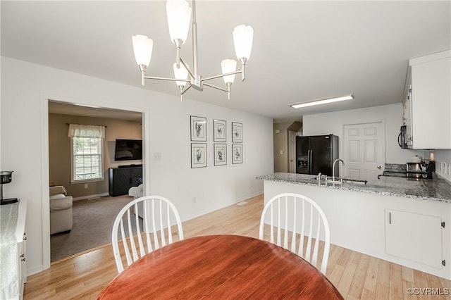 13730 Village View Dr, Midlothian, VA 23114 - dining room with light wood finished floors and a chandelier
