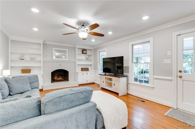 11905 Glen Gary Ct, Henrico, VA 23233 - living area featuring crown molding, ceiling fan, light wood-type flooring, a large fireplace, and recessed lighting