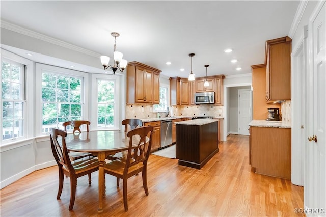11905 Glen Gary Ct, Henrico, VA 23233 - dining room with ornamental molding, light wood finished floors, a chandelier, and recessed lighting