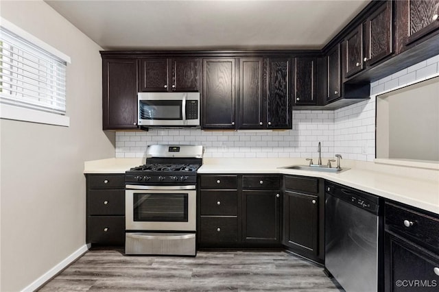 10152 Iron Mill Rd, North Chesterfield, VA 23235 - kitchen featuring appliances with stainless steel finishes, tasteful backsplash, and light countertops