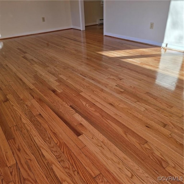 14300 Rosebud Rd, Chesterfield, VA 23838 - empty room with light wood-style floors and a baseboard heating unit