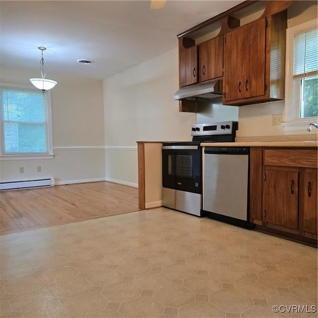 14300 Rosebud Rd, Chesterfield, VA 23838 - kitchen featuring under cabinet range hood, stainless steel appliances, light flooring, a baseboard radiator, and brown cabinetry