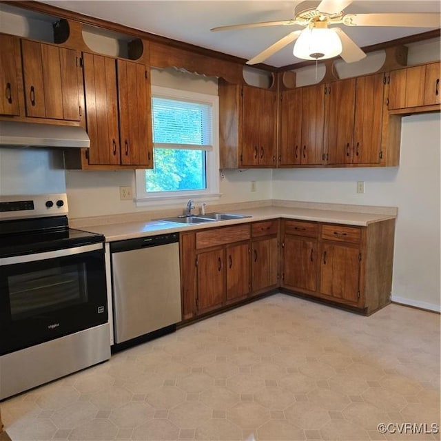 14300 Rosebud Rd, Chesterfield, VA 23838 - kitchen featuring stainless steel appliances, under cabinet range hood, brown cabinetry, light countertops, and a ceiling fan