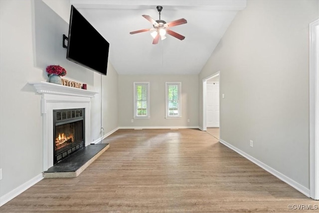 12707 Southwick Pl, Midlothian, VA 23113 - unfurnished living room featuring ceiling fan, wood finished floors, lofted ceiling, and a warm lit fireplace