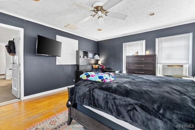 2560 Pin Oak Ct, Colonial Heights, VA 23834 - bedroom with wood finished floors, a textured ceiling, ornamental molding, and a ceiling fan