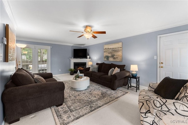 15619 Winding Ash Dr, Chesterfield, VA 23832 - living room featuring crown molding, ceiling fan, carpet, and a warm lit fireplace