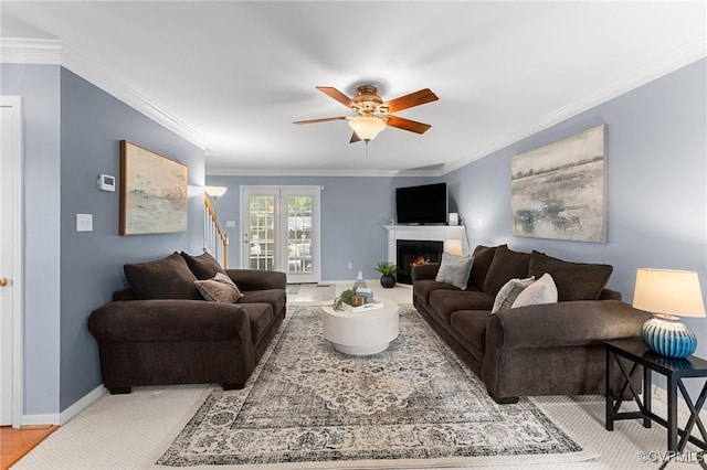 15619 Winding Ash Dr, Chesterfield, VA 23832 - living room with crown molding, ceiling fan, a lit fireplace, and stairway