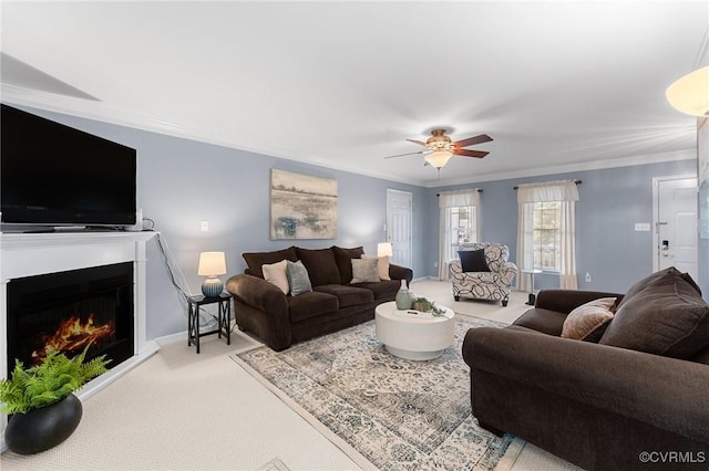 15619 Winding Ash Dr, Chesterfield, VA 23832 - carpeted living room with a ceiling fan, a warm lit fireplace, and ornamental molding