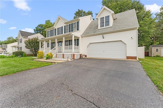 15619 Winding Ash Dr, Chesterfield, VA 23832 - view of front of home featuring covered porch, asphalt driveway, a front lawn, and an attached garage