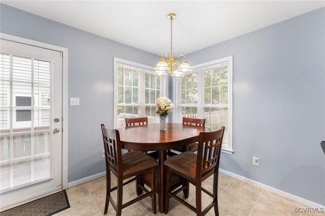 15619 Winding Ash Dr, Chesterfield, VA 23832 - dining room featuring a chandelier and light tile patterned flooring