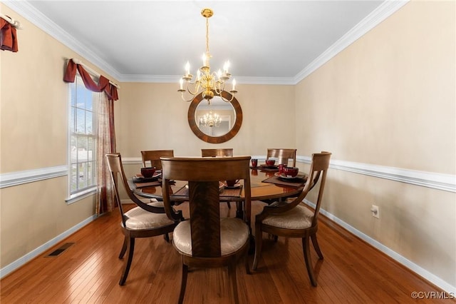 15619 Winding Ash Dr, Chesterfield, VA 23832 - dining space with a chandelier, hardwood / wood-style flooring, and crown molding