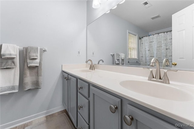 15619 Winding Ash Dr, Chesterfield, VA 23832 - full bathroom with double vanity and wood finished floors