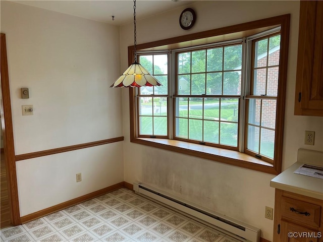 8426 Forge Rd, Henrico, VA 23228 - unfurnished dining area with a baseboard radiator and baseboards