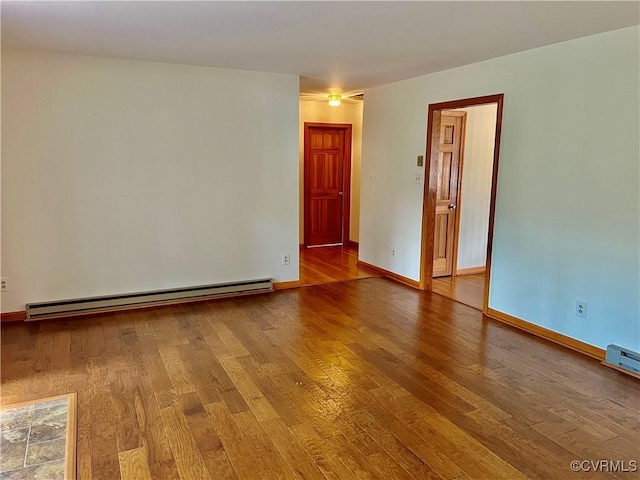 8426 Forge Rd, Henrico, VA 23228 - spare room with baseboard heating and wood finished floors