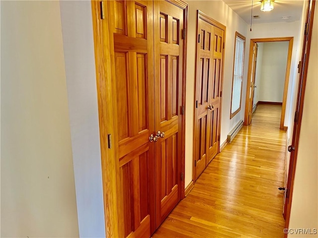 8426 Forge Rd, Henrico, VA 23228 - hall with light wood-type flooring and a baseboard radiator