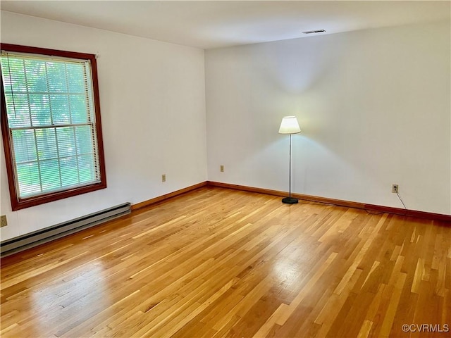 8426 Forge Rd, Henrico, VA 23228 - unfurnished room with light wood-type flooring and a baseboard heating unit