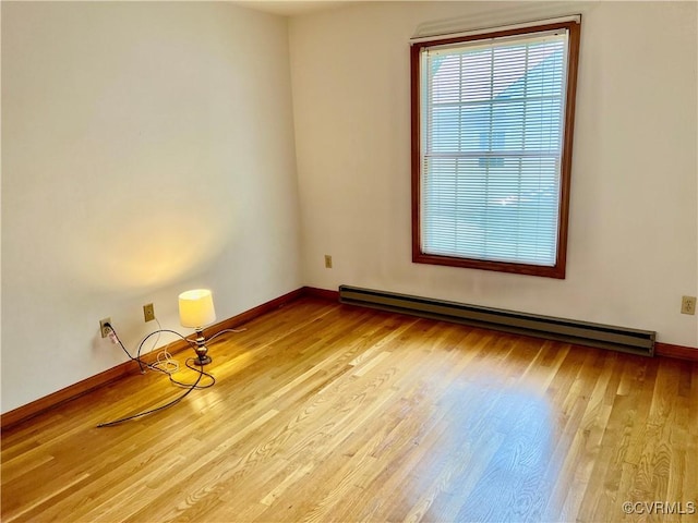8426 Forge Rd, Henrico, VA 23228 - empty room featuring baseboard heating and wood finished floors