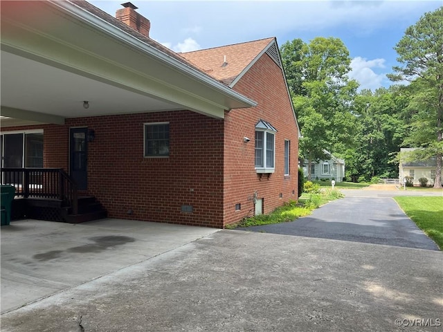 8426 Forge Rd, Henrico, VA 23228 - view of home's exterior with brick siding, crawl space, and a chimney