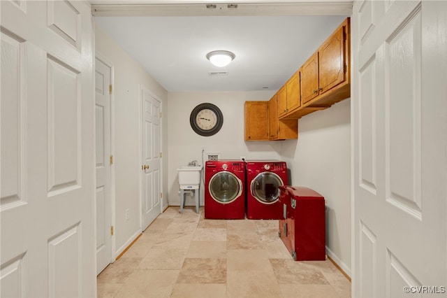 419 Carter Ln, Louisa, VA 23093 - laundry room featuring independent washer and dryer, cabinet space, and stone finish floors