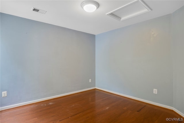 419 Carter Ln, Louisa, VA 23093 - spare room featuring attic access and wood finished floors