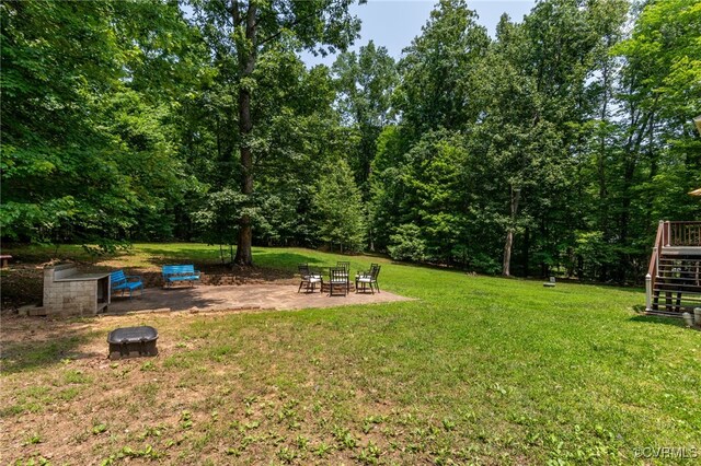 419 Carter Ln, Louisa, VA 23093 - view of grassy yard with a fire pit, stairway, and a patio area