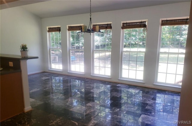 419 Carter Ln, Louisa, VA 23093 - unfurnished dining area featuring plenty of natural light and a chandelier
