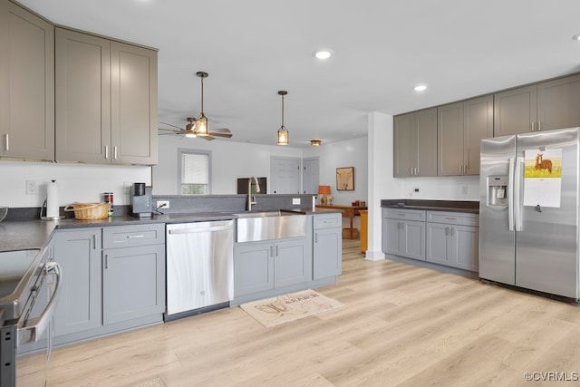 9530 Dabneys Mill Rd, Manquin, VA 23106 - kitchen featuring stainless steel appliances, gray cabinets, dark countertops, a peninsula, and a ceiling fan
