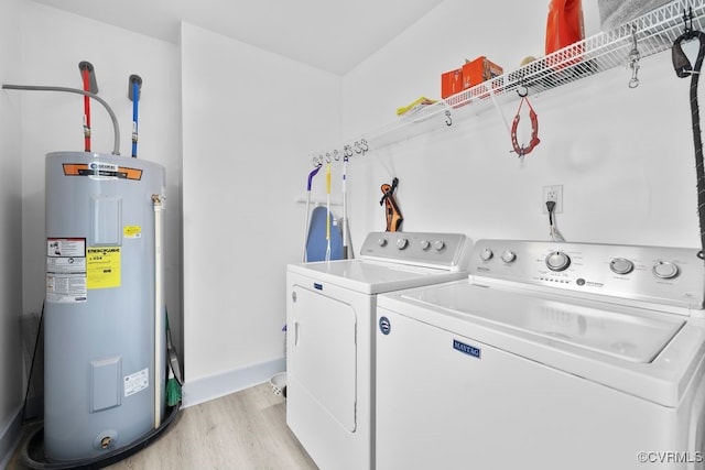9530 Dabneys Mill Rd, Manquin, VA 23106 - washroom featuring water heater, washing machine and clothes dryer, and light wood-style flooring