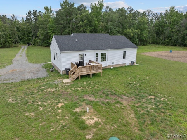 9530 Dabneys Mill Rd, Manquin, VA 23106 - back of house featuring a wooden deck, a yard, roof with shingles, and a forest view