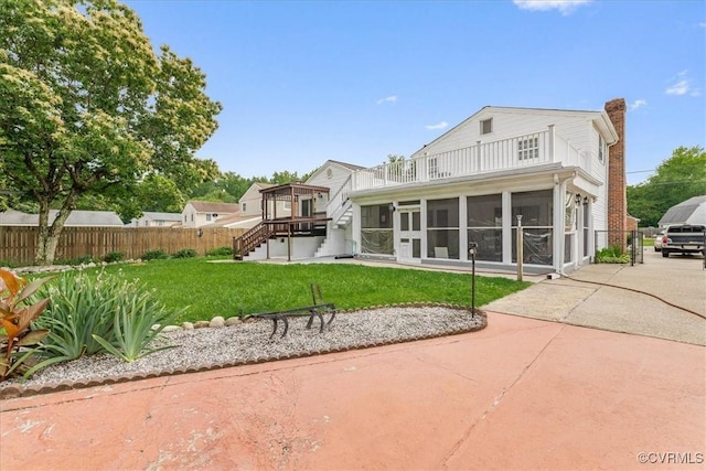 708 Compton Rd, Colonial Heights, VA 23834 - rear view of house featuring a sunroom, a balcony, stairway, and a chimney