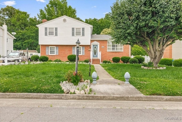 708 Compton Rd, Colonial Heights, VA 23834 - split level home featuring brick siding, entry steps, and a front yard