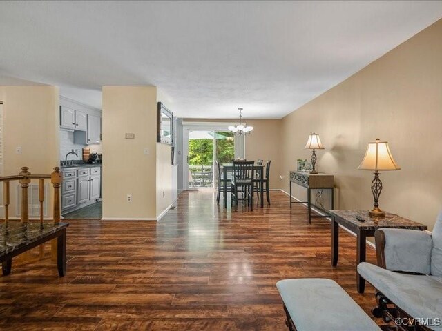 8507 Spruce Pine Dr, North Chesterfield, VA 23235 - living area with dark wood-style floors and a chandelier