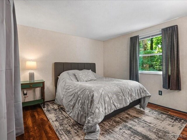 8507 Spruce Pine Dr, North Chesterfield, VA 23235 - bedroom featuring wood finished floors and a textured wall