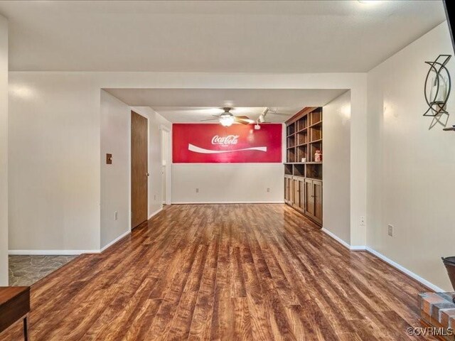 8507 Spruce Pine Dr, North Chesterfield, VA 23235 - empty room with wood finished floors and a ceiling fan