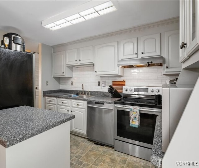8507 Spruce Pine Dr, North Chesterfield, VA 23235 - kitchen with stainless steel appliances, under cabinet range hood, tasteful backsplash, stone finish floors, and white cabinetry