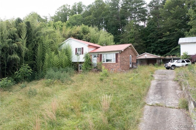 549 Ararat Hwy, Patrick Springs, VA 24053 - tri-level home with brick siding, driveway, and a metal roof