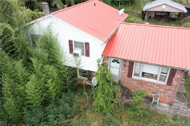 549 Ararat Hwy, Patrick Springs, VA 24053 - view of front of house featuring brick siding, a metal roof, and cooling unit