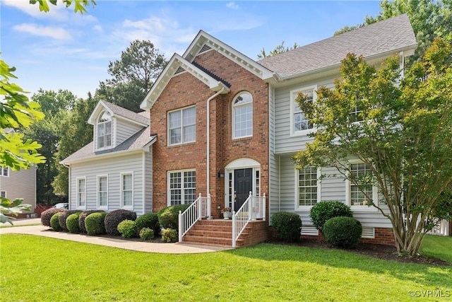 9563 Plateau Pl, Mechanicsville, VA 23116 - view of front of home with a front yard and brick siding