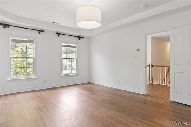 9563 Plateau Pl, Mechanicsville, VA 23116 - empty room featuring wood finished floors, a smoke detector, and a tray ceiling