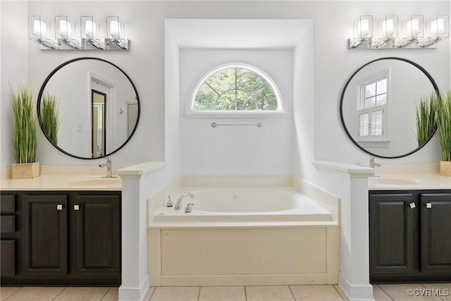 9563 Plateau Pl, Mechanicsville, VA 23116 - bathroom featuring two vanities, a bath, and tile patterned flooring