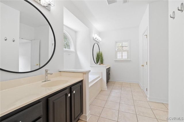 9563 Plateau Pl, Mechanicsville, VA 23116 - full bathroom featuring vanity, healthy amount of natural light, a garden tub, and tile patterned floors