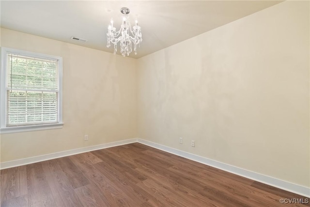 9563 Plateau Pl, Mechanicsville, VA 23116 - spare room featuring a chandelier and dark wood finished floors