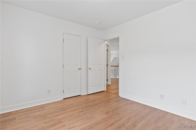 9563 Plateau Pl, Mechanicsville, VA 23116 - unfurnished bedroom with baseboards and light wood-style floors