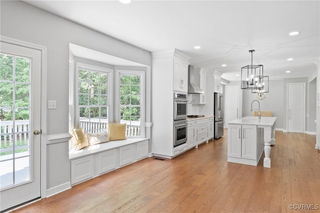 9563 Plateau Pl, Mechanicsville, VA 23116 - kitchen featuring stainless steel appliances, light wood-type flooring, white cabinetry, a chandelier, and light countertops