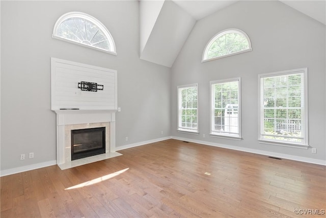 9563 Plateau Pl, Mechanicsville, VA 23116 - unfurnished living room featuring high vaulted ceiling, wood finished floors, and a high end fireplace