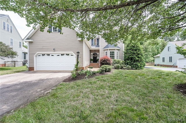 7618 Old Track Ln, Mechanicsville, VA 23111 - traditional home with asphalt driveway, a front yard, and a garage