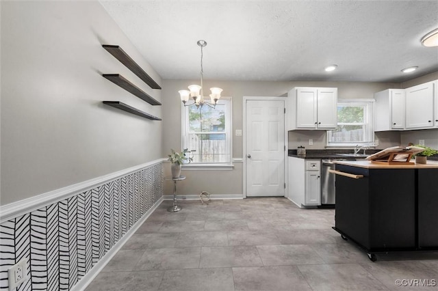 410 Airycrest Dr, Highland Springs, VA 23075 - kitchen featuring white cabinets, a chandelier, hanging light fixtures, and a textured ceiling