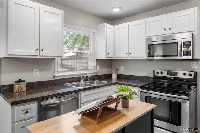 410 Airycrest Dr, Highland Springs, VA 23075 - kitchen featuring stainless steel appliances, white cabinetry, and wood counters